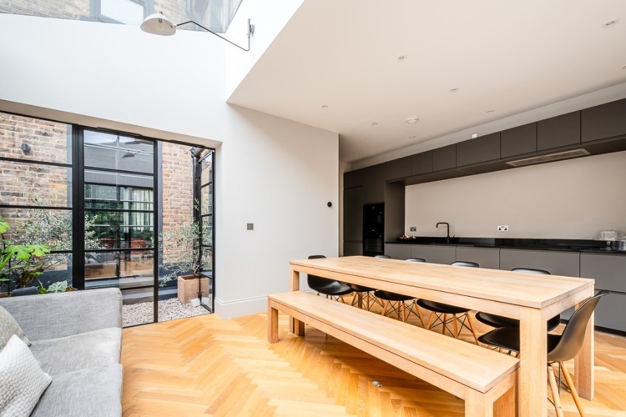 Bespoke London basement kitchen by UHM Basements, herringbone flooring, integrated joinery